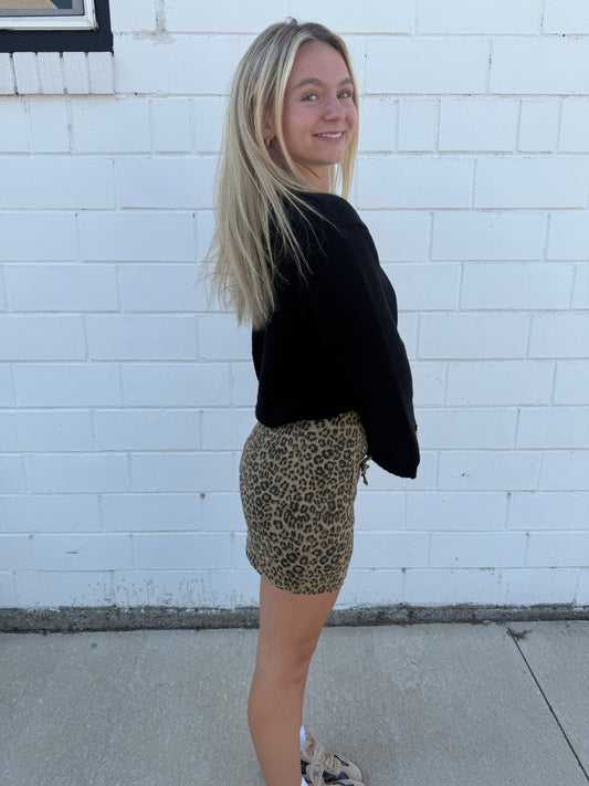 Willow leopard animal print mini skirt bows front pockets built-in shorts stretchy zip back