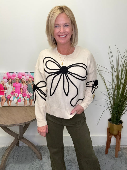 Ivory cropped sweater black bow outline trim adora boutique Roanoke indiana