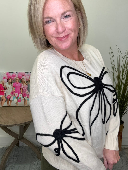 Ivory cropped sweater top black bow outline trim adora boutique Roanoke indiana