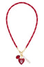 A red braided cord necklace gold hardware, dangling red heart charm with the Indiana Hoosiers 'IU' logo and a small red oval charm with 'HOOSIERS' text. Womens ncaa jewelry